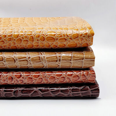 गर्म बिक्री पीवीसी चमकदार उच्च चमक सिंथेटिक चमड़े जूते बैग नोटबुक फर्नीचर उपयोग के लिए उभरा पत्थर पैटर्न